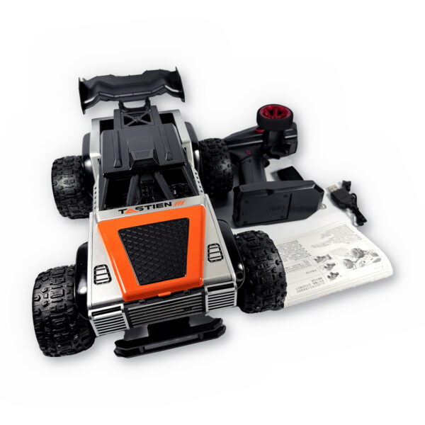 TASTIEN RC Truck - Box Contents TASTIEN RC truck with its 2.4GHz pistol-grip remote controller, USB charging cable and instruction manual