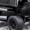 TASTIEN RC Truck - LED Light Bar and Off-Road Tyres Close-up of the TASTIEN RC truck LED light bar and deep-tread off-road tyre with coil-over shock