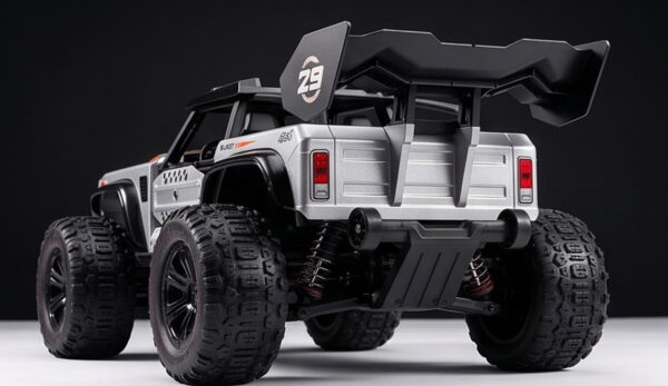 TASTIEN RC Truck - Rear Angle and Wing Rear three-quarter view of the TASTIEN RC truck showing the wing, rear suspension springs and skid plate