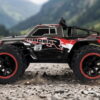 Yile Storm RC Truck - Gravel Action Red and grey Yile Storm RC truck spraying gravel as it accelerates on a mountain track