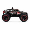 Yile Storm RC Truck - Red Side Profile Side profile of the metallic grey and red Yile Storm RC truck showing the RACER splash graphics and red-ringed wheels